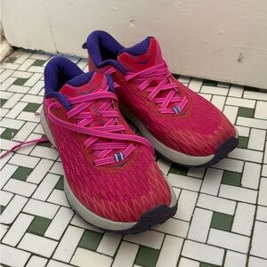 Pink Hoka Trail shoes